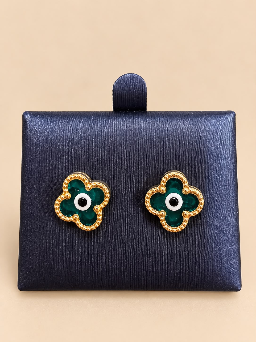 14K yellow gold green four-petal flower design with an evil eye center