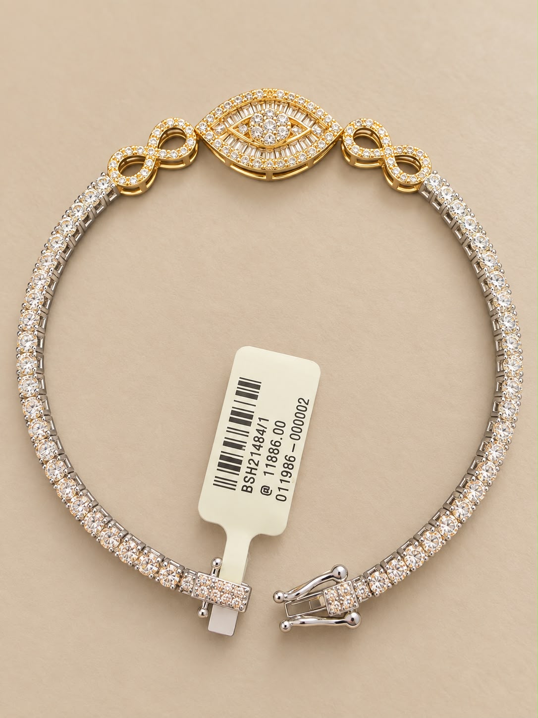 Stunning 14K White Gold Natural Diamond Bracelet featuring an elegant eye-inspired centerpiece with beautiful yellow gold accents.