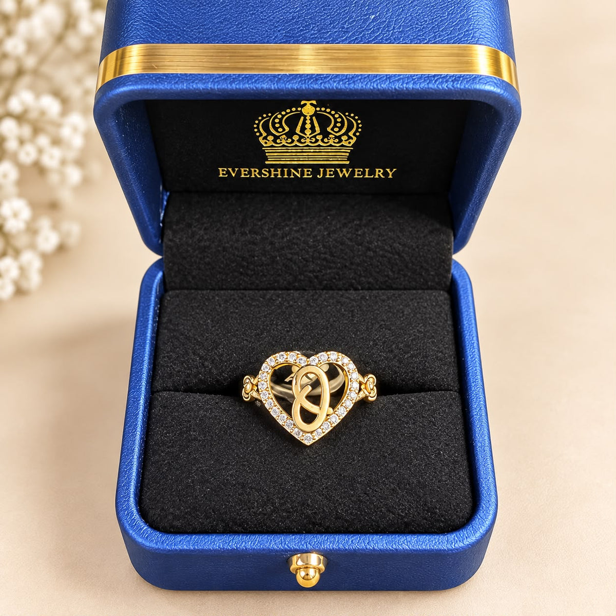Beautiful 10K Yellow Gold Heart Initial Ring featuring sparkling CZ stones surrounding a heart-shaped design, with elegant rose accents on both sides.