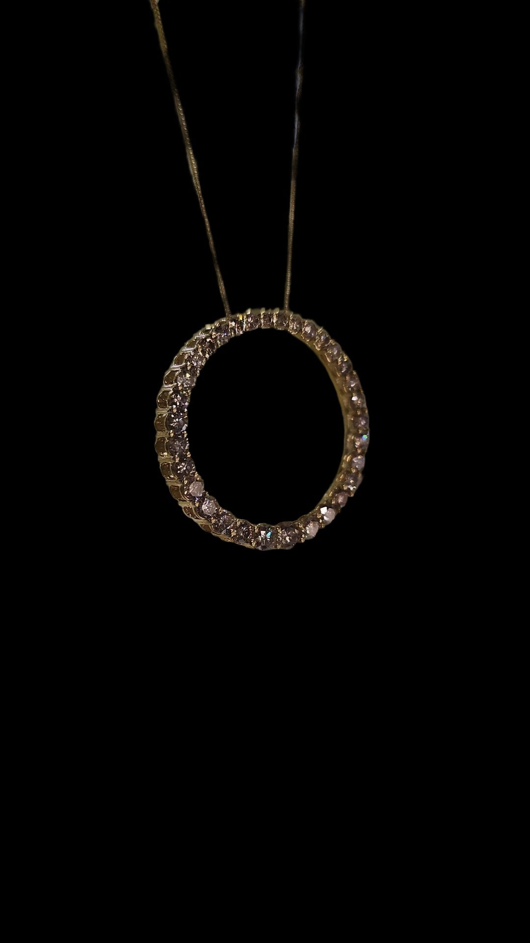 The golden circle charm